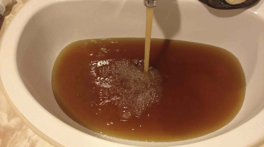 Brown water pouring from sink