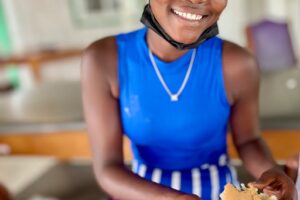 Photo of a happy Haitian woman who was later deported and killed.